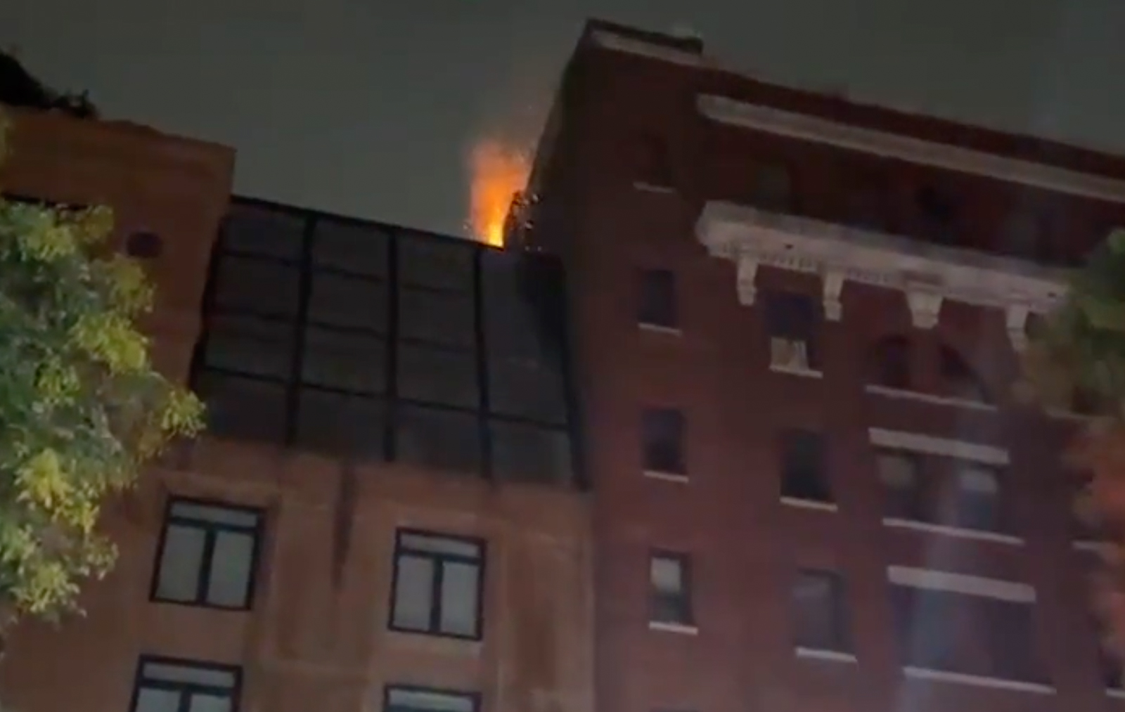 Screenshot from video recorded for Citizen.com shows flames emanating from the roof of the Tribeca Film Center. Credit: Citizen.com.